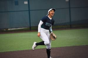 Bailey Brader celebrates a strikeout with a scream in support of Danica Butler. Ben Ray / The Reporter