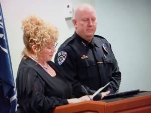 Mayor Nancy Backus commemorates Auburn Police Chief Mark Cailliers 30 years of service. Photo by Robert Whale/Auburn Reporter