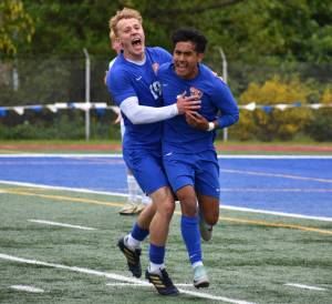 Davyd Fedina and Benji Toscano celebrate after taking the lead in the second half over Bainbridge. Ben Ray / The Reporter