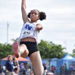 Cassie Atkins of Federal Way High School soars through the air for her second straight long jump title. Ben Ray / The Mirror