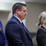 Auburn Police Officer Jeffrey Nelson, flanked by attorneys, stands as two guilty verdicts are handed down Thursday, June 27, 2024, at the King County Maleng Regional Justice Center in Kent. (Ken Lambert / The Seattle Times / Pool)
