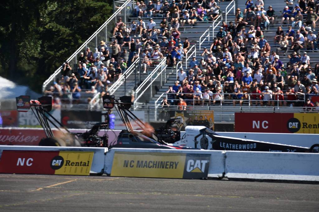 A pair of Top Fuel cars racing in the first round preliminary races. Ben Ray / The Reporter