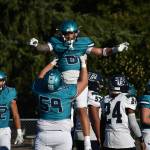 Auburn Riverside celebrates a touchdown. (Sound Publishing file photo)