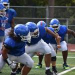 Linemen at Kent-Meridian put in the work. Ben Ray / The Reporter