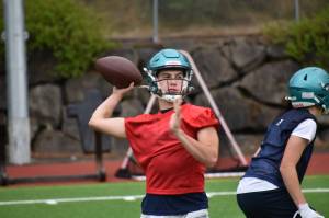 Quarterback Andrew Wold makes a throw during simulation drills act practice.