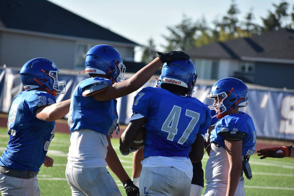 Lion scout team offense gets a head tap from a defender after a good rep. Ben Ray / The Reporter