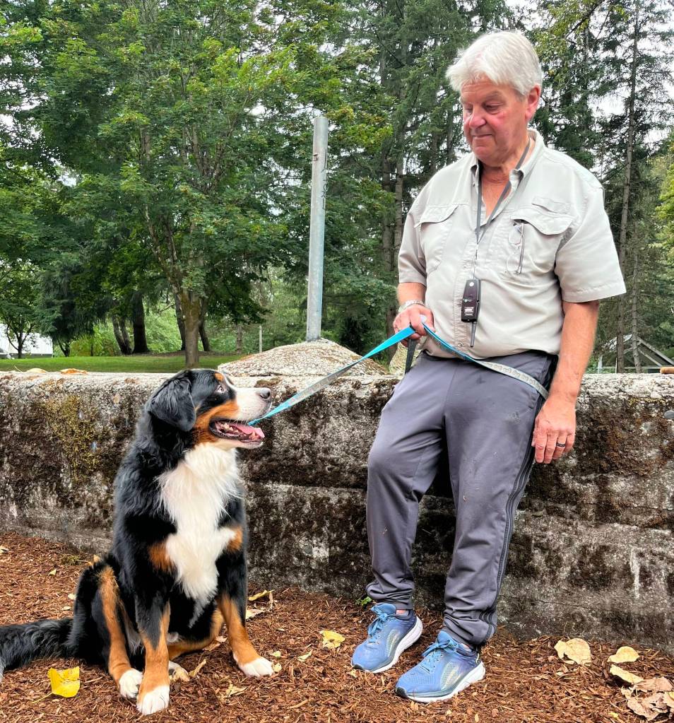 Left, Todd Weston and his dog, Sam, enjoy the ribbon cutting ceremony Oct. 1 at Game Farm Park.