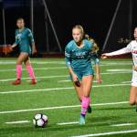 Photos by Ben Ray / The Reporter
Raven junior Harper Curnutt keeps her eyes up as she searches for a pass against the Lancers.