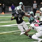 Ben Ray / The Reporter
Senior running back Antoine Lee avoids a Trojan defender early in the game against Auburn.