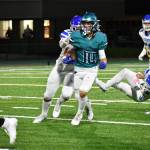 Senior Aiden Schmitz with a catch and run over the middle of the field. Ben Ray / The Reporter