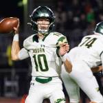 Baylen Erdmann #10 of the Auburn Trojans throws a pass during a football game against the Sumner Spartans at Sunset Chev Stadium on Nov. 8. Photos by Henry Rodenburg