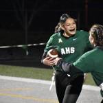 Two Auburn players celebrate a touchdown in the endzone at Kentwood. Ben Ray / The Reporter