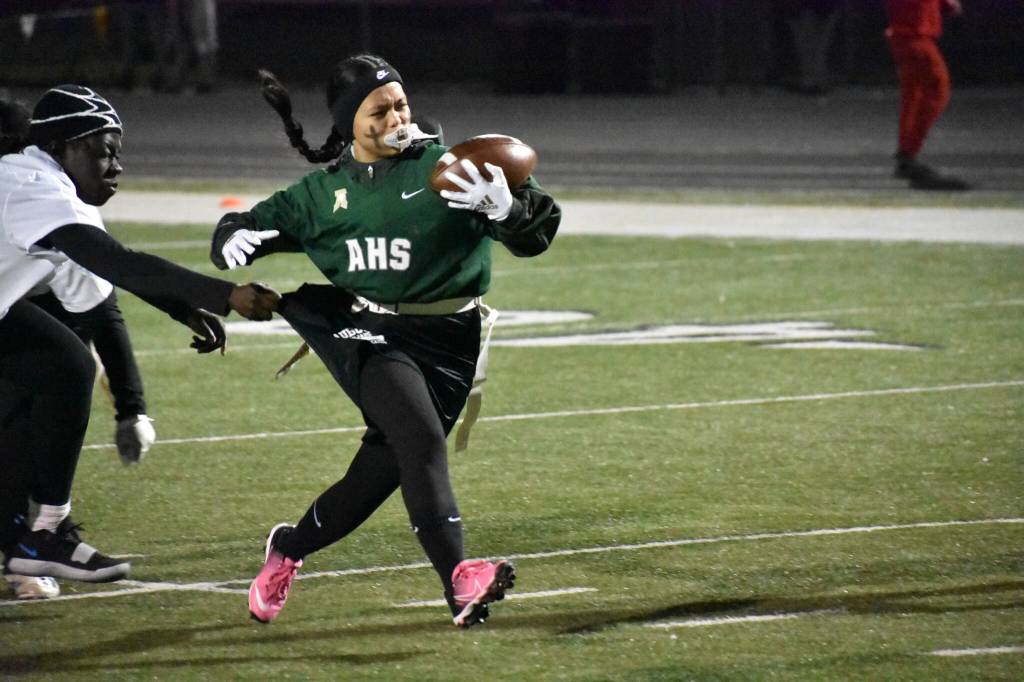 Auburn girls running back runs the ball up the field. Ben Ray / The Reporter