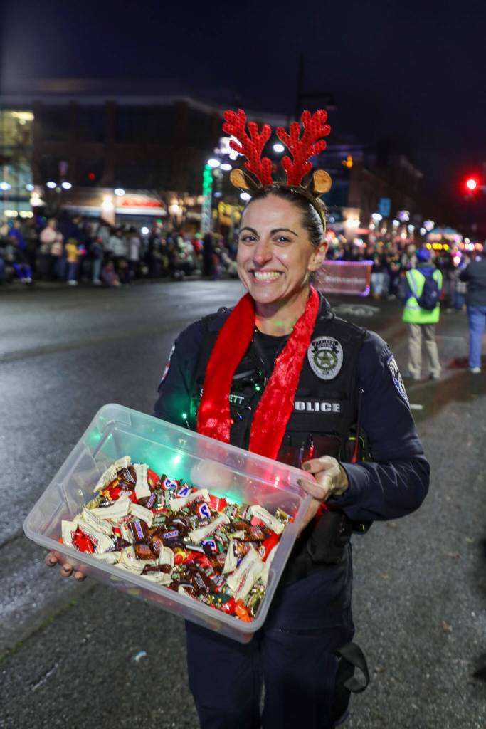 Photo courtesy of City of Auburn
Under the horns, Auburn Police Officer Stephanie Bennett displays a box of treats befitting the Christmas season.