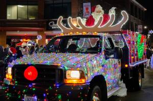 A truck tricked out with the bright, cheerful lights of the Christmas season.