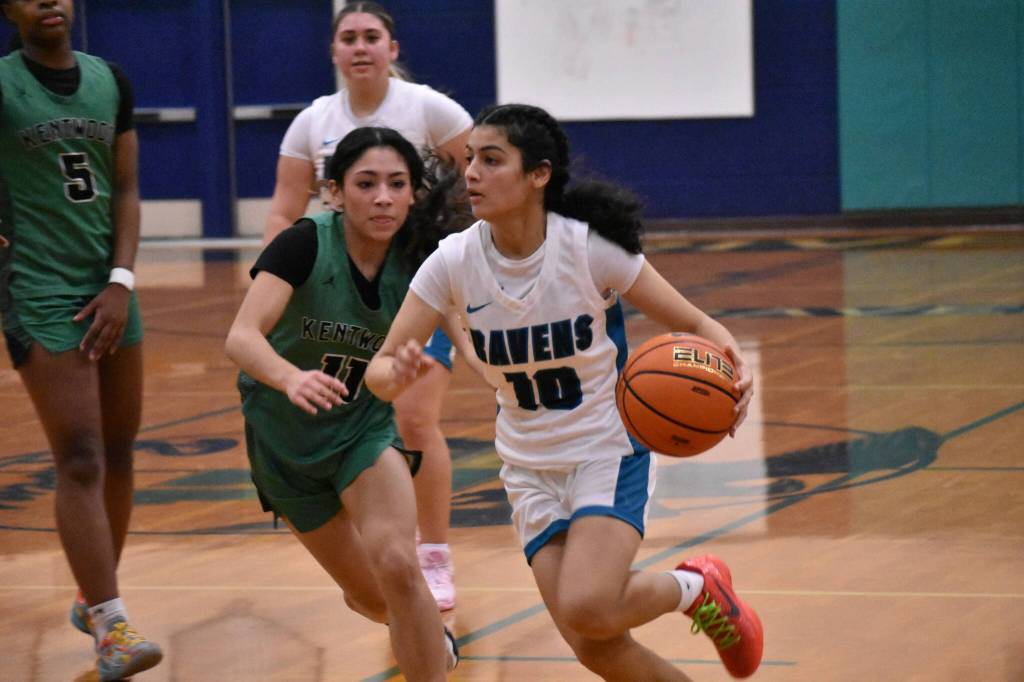 C.K. Kandola keeps her head up as she dribbles the basketball. Ben Ray / The Reporter