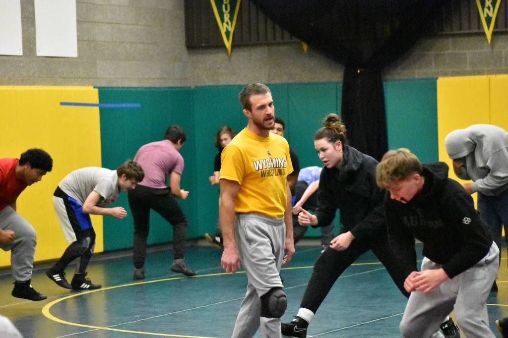 Shane Ornufer talks with Bryce Rowland as practice gets underway. Ben Ray / The Reporter