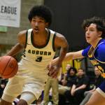 Photos by Ben Ray / The Reporter
Trojan junior Daniel Johnson drives to the basket.