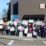 Fifty protesters held up a variety of signs at the Renton location for the Jan. 18, 2024 Womens March and Peoples March. Photo by Bailey Jo Josie/Sound Publishing.