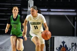 Auburns Kaleesa Howard dribbles the ball up the floor for the Trojans. Ben Ray / The Reporter