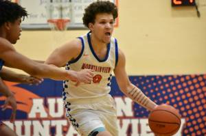 Lucas McClendon fights off a defender. Ben Ray / The Reporter