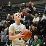 Auburns Avery Hansen prepares for take off in the district tournament. Photos by Ben Ray / The Reporter