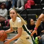 Morgan Richardson dribbles the basketball against Emerald Ridge. Ben Ray / The Reporter