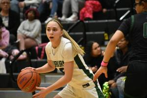 Morgan Richardson dribbles the basketball against Emerald Ridge. Ben Ray / The Reporter