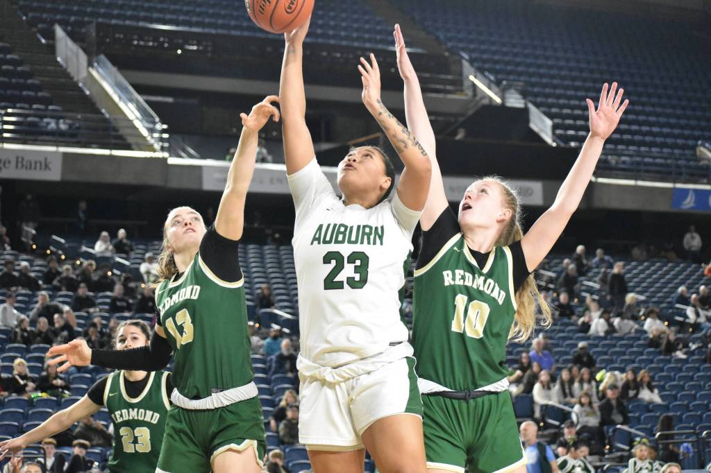 Ari Deloney goes up for a shot against Redmond. Ben Ray / The Reporter