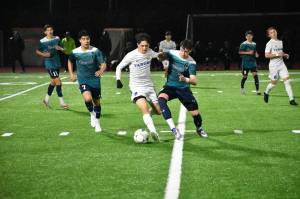 Tima Vereminy battles for the ball against Tahoma. Ben Ray / The Reporter