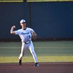 Andre Muneton makes a throw across the diamond. Ben Ray / The Reporter