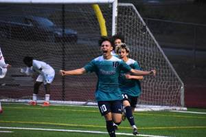 Auburn Riverside striker Aidan Marcianiak scores the games first goal. Ben Ray / The Reporter