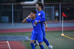 Sergio Mercado leaps on the shoulders of Pablo Montiel after he scores his first goal of the night. Ben Ray / The Reporter
