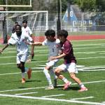 Jenish Thapa battles for the ball against Mercer Island. Ben Ray / The Reporter
