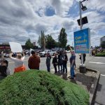 Protesters react to the many honking cars. Photo by Robert Whale/Auburn Reporter
