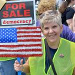Vicki Bates, a former employee of the Auburn School District, at the No Kings protest. Photo by Robert Whale/Auburn Reporter