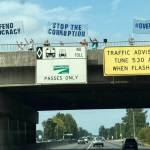People protest along the South 277th Street overpass Sept. 1 on State Route 167 on the Kent/Auburn border.