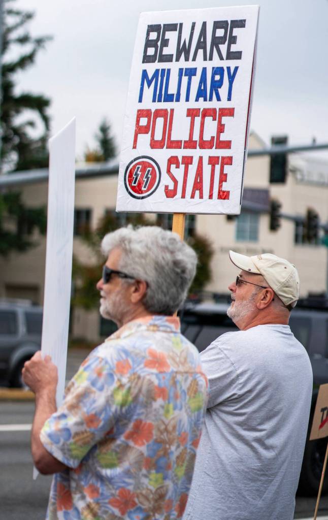 People show up Sept. 1 along SE 272nd Street in Covington for an anti-Trump rally.