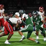 A pair of Auburn defenders tackle a Kennedy Catholic running back. Ben Ray / The Reporter