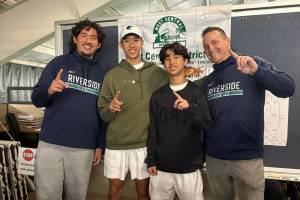 Auburn Riverside celebrates 4A West Central District doubles championship. Photo by Nathan Hyun