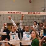 Georgia DePiano (left) and Quinci Wilder (right) come down after a block against Emerald Ridge. Ben Ray / The Reporter