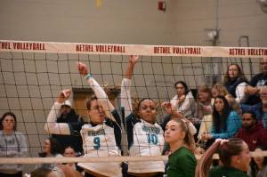 Georgia DePiano (left) and Quinci Wilder (right) come down after a block against Emerald Ridge. Ben Ray / The Reporter