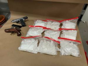 Firearms and methamphetamine allegedly seized from the arrest. Courtesy photo.