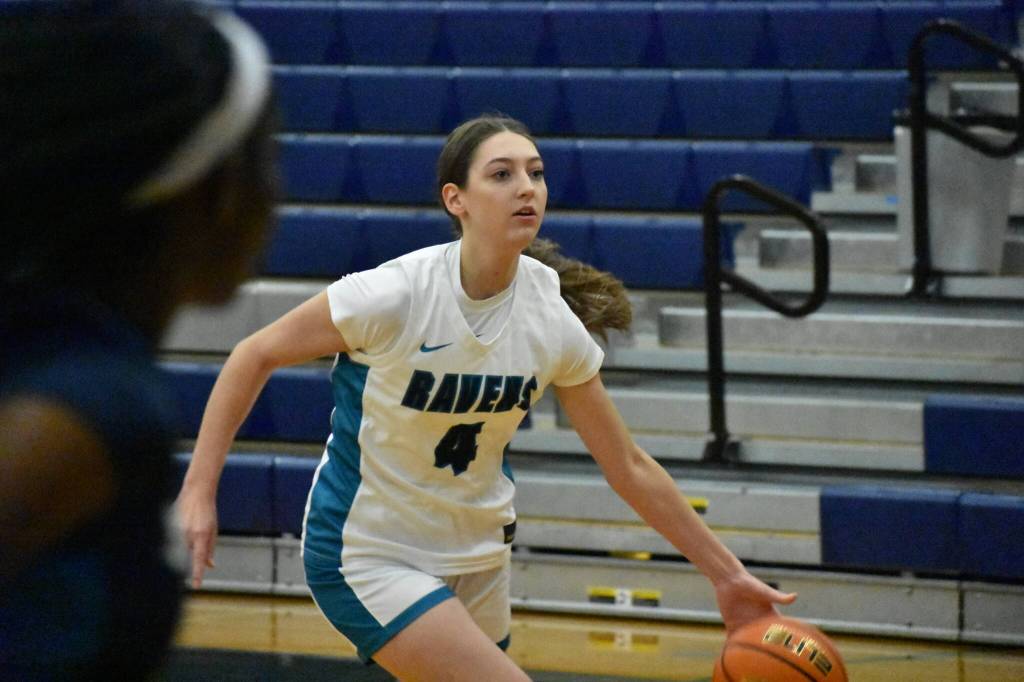 Cora Lowe drives to the basket during the lay-up line warm-up at Auburn Riverside. Ben Ray / The Reporter