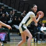 Kamryn Huttenlocker holds the ball with her back to the basket against North Thurston. Ben Ray / The Reporter