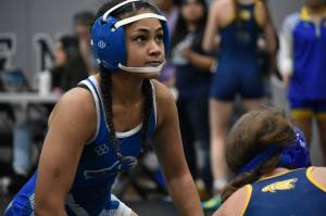 Auburn Mountainviews Fia Daniels looks at the ref after her win at Kentwood. Ben Ray / The Reporter