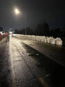 Washington State Department of Transportation crews placed hundreds of sandbags Sunday, Dec. 14 and overnight into the early morning of Monday, Dec. 15 along Highway 167 in Kent and Auburn to redirect flooding from the Green River. COURTESY PHOTO, WSDOT