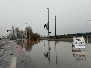 The flooded intersection of Auburn Way North and South 52nd Street on Thursday, Dec. 11. Photo by Joshua Solorzano/Sound Publishing