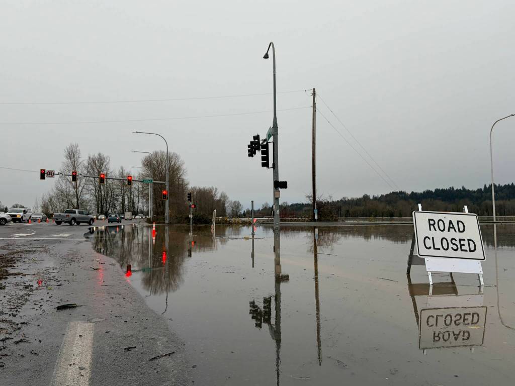 Auburn saw historic flooding of the Green River and White River during the atmospheric river weather system that inundated Western Washington for nearly two weeks in December. Pictured: The flooded intersection of Auburn Way North and South 52nd Street on Thursday, Dec. 11. Photo by Joshua Solorzano/Sound Publishing