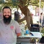 Rhett Fraticelli, meadsmith and brew alchemist for Valhalla Mead, displays the tasty beverages Sept. 13 at the annual Hops and Crops Beer and Music Festival. Photo by Robert Whale/Auburn Reporter